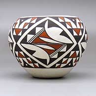 A polychrome jar decorated with a four-panel geometric design, click or tap to see a larger version