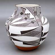 A polychrome jar decorated with a four-panel black-on-white fine line and geometric design
 by Evelyn Cheromiah of Laguna