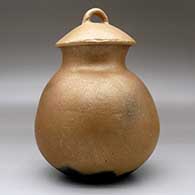 A lidded golden micaceous jar with fire clouds, click or tap to see a larger version