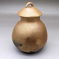 A lidded golden micaceous jar with fire clouds
 by Cecilia A Martinez of Picuris