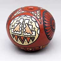 A polychrome seed pot decorated with a four-panel medallion-with-feathers and medallion with cloud and mountain geometric designs
 by Minnie Vigil of Santa Clara