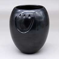 A black jar decorated with two bear paw imprints above the shoulder
 by Cliff Roller of Santa Clara