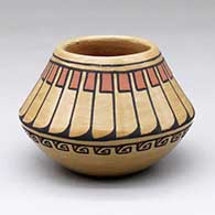 A small polychrome jar decorated with a band-of-feathers and geometric design
 by Minnie Vigil of Santa Clara