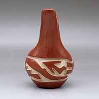 A red wedding vase carved with an avanyu design around the body, click or tap to see a larger version