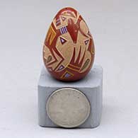 A miniature polychrome seed pot decorated with a sgraffito-and-painted antelope and geometric design
 by Ray Tafoya of Santa Clara