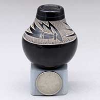 A miniature black jar with a sgraffito geometric design above the shoulder
 by Haungooah aka Art Cody of Santa Clara