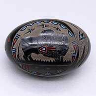 A polychrome oval seed pot decorated with a sgraffito-and-painted bison-with-heart-line and geometric design
 by Ray Tafoya of Santa Clara