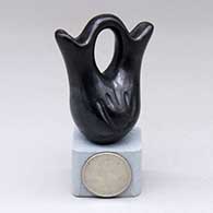 A miniature black wedding vase with two bear paw imprints
 by Teresita Naranjo of Santa Clara