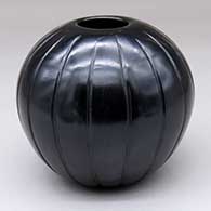 A black melon jar lightly carved with 17 ribs
 by Joy Cain of Santa Clara