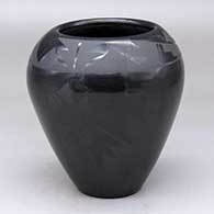 A black on black jar decorated with a geometric design
 by Yolanda Velarde of Santa Clara