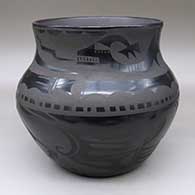 A large black-on-black jar decorated with an avanyu and geometric design
 by Carmelita Dunlap of San Ildefonso