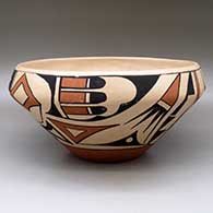 A large, open polychrome bowl decorated with a bird element and geometric design around the body
 by Carlos Sunrise Dunlap of San Ildefonso