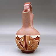 A polychrome Potsuwii-style wedding vase carved and painted around the body with a four-panel feather, kiva step and geometric design, plus micaceous clay above and below the carved band, click or tap to see a larger version