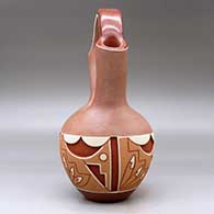 A polychrome Potsuwii-style wedding vase carved and painted around the body with a four-panel feather, kiva step and geometric design, plus micaceous clay above and below the carved band, click or tap to see a larger version