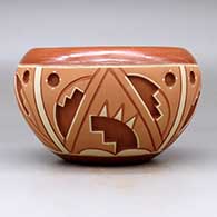 A polychrome Potsuwii-style jar decorated with a four-panel painted and carved kiva step and geometric design around the body, click or tap to see a larger version
