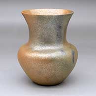 A golden micaceous vase with fire clouds
 by Angie Yazzie of Taos