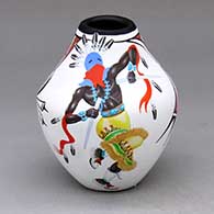 A polychrome jar decorated with a painted four-panel pueblo dancer and geometric design
 by Marcellus Medina of Zia