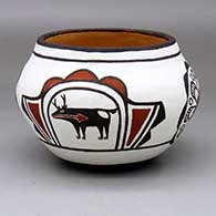 A polychrome jar decorated with a four-panel deer-with-heart-line, medallion and geometric design
 by Nellie Bica of Zuni