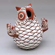 An owl storyteller figure with seven chicks
 by Nellie Bica of Zuni