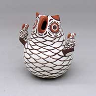 An owl storyteller figure with two chicks
 by Nellie Bica of Zuni