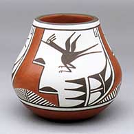 A polychrome jar decorated with a three-panel roadrunner, cloud formation and geometric design
 by Eusebia Shije of Zia