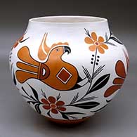 A polychrome jar decorated with a four panel parrot, branch, flower and geometric design
 by Debbie Brown of Acoma