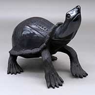 Click for a larger view A black on black turtle figure decorated with a lightly carved and painted checkerboard and geometric design
by Nicolas Ortiz of Mata Ortiz and Casas Grandes