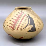 A Ramos polychrome jar decorated with a two-panel geometric design
 by Juan Quezada Sr of Mata Ortiz and Casas Grandes