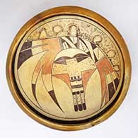 An open polychrome serving bowl decorated with a bird-hanging-from-sky-band, bird element and geometric design
 by Nampeyo of Hano of Hopi