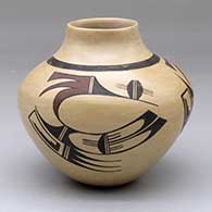 A polychrome white ware jar decorated with a three-panel bird element and geometric design
 by White Swann of Hopi