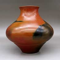 A brown jar with a recurved rim and fire clouds, click or tap to see a larger version
