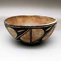 A polychrome dough bowl polished inside and decorated outside with a seven-panel geometric design
 by Unknown of Santo Domingo