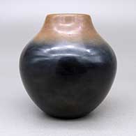 Small polished black jar with a sienna rim, click or tap to see a larger version