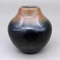 Small polished black jar with a sienna rim
 by Russell Sanchez of San Ildefonso