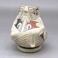 A replica Ramos Polychrome figure from the days of Paquime
 by Nicolas Quezada of Mata Ortiz and Casas Grandes