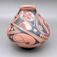Polychrome jar with a flared opening and a geometric design
 by Juan Quezada Sr of Mata Ortiz and Casas Grandes