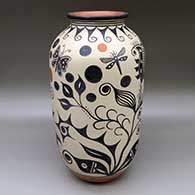 A tall polychrome jar decorated with a two panel rainbird, flower, butterfly, dragonfly and geometric design
 by Thomas Tenorio of Santo Domingo