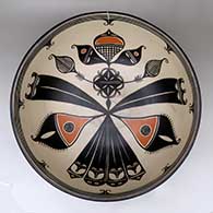 A large polychrome bowl decorated inside with a cotton plant, feathers and geometric design, and around the outside with a black on white geometric design
 by Thomas Tenorio of Santo Domingo