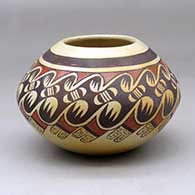 A polychrome jar decorated around the shoulder with a bat wing, bird element and geometric design
 by Fannie Nampeyo of Hopi