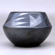 A black on gunmetal black jar decorated with a four-panel bat wing and geometric design above the shoulder, click or tap to see a larger version