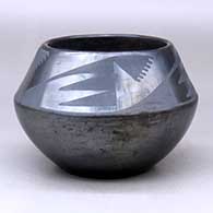 A black on gunmetal black jar decorated with a four-panel bat wing and geometric design above the shoulder
 by Maria Martinez of San Ildefonso