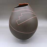 A polychrome jar with an organic opening and a flowing geometric design
 by Diego Valles of Mata Ortiz and Casas Grandes