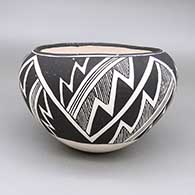 Black-on-white bowl with a fine line and geometric design
 by Lucy Lewis of Acoma