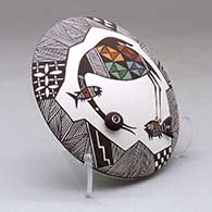 A polychrome seed pot decorated with appliques and a cloudeater, fish, fineline and geometric design, click or tap to see a larger version