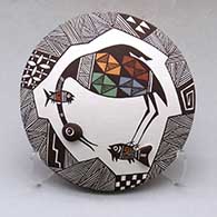 Click for a larger view A polychrome seed pot decorated with appliques and a cloudeater, fish, fineline and geometric design
by Carolyn Concho of Acoma