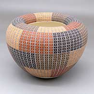 A polychrome Infinity pot decorated with a four-panel geometric design
 by Frederica Antonio of Acoma