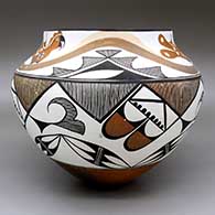 Polychrome jar with a traditional Acoma design featuring parrot, fine line, and geometric elements, click or tap to see a larger version