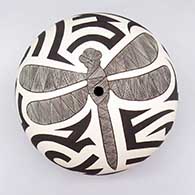 Black-on-white seed pot with a dragonfly, fine line, and bold geometric design
 by Eric Lewis of Acoma