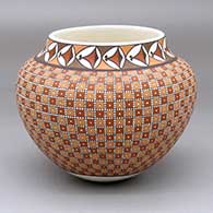 A polychrome jar decorated with a modified checkerboard and geometric design, pot painted during 5/3/24 video demo
 by Frederica Antonio of Acoma