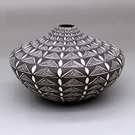 A black-on-white jar decorated with a geometric design
 by Sandra Victorino of Acoma